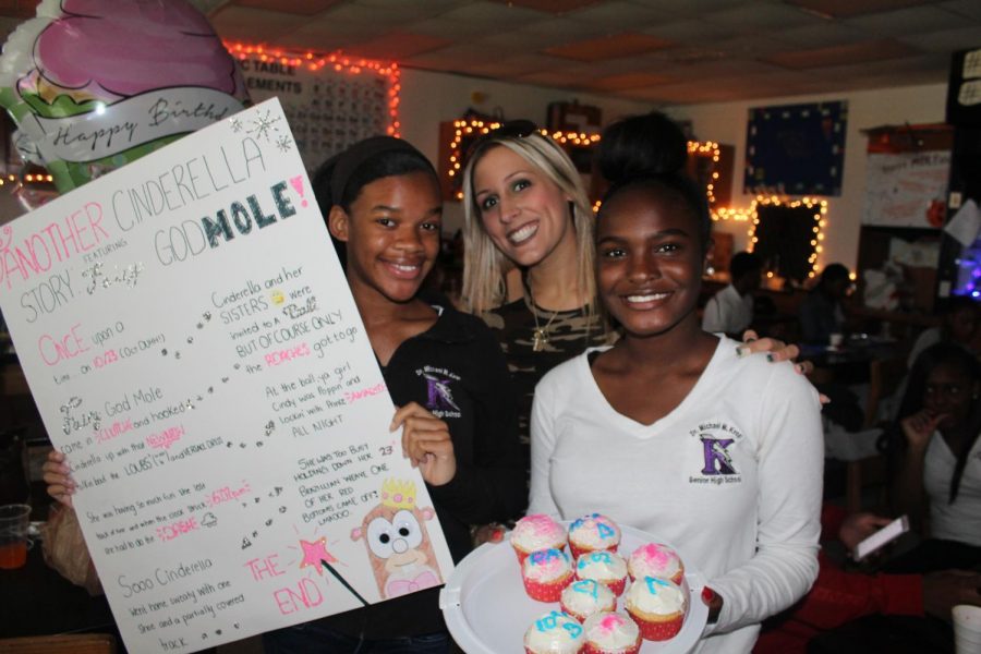Students show Munzenberger their Fairy Godmole and magical cupcake project for Mole Day. 