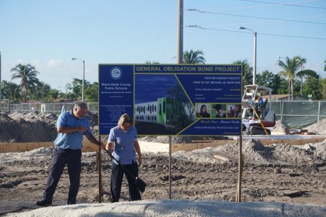 Custodians Jesus Diaz and Marvelia Mansur lay the sand on the site of the iPrep construction zone in preparation for the ceremonial groundbreaking on Monday, Nov. 6, 2017. MDCPS district officials joined Superintendent of Schools Alberto Carvhalo and Krop faculty and students to unveil the beginning of construction of the new academy.