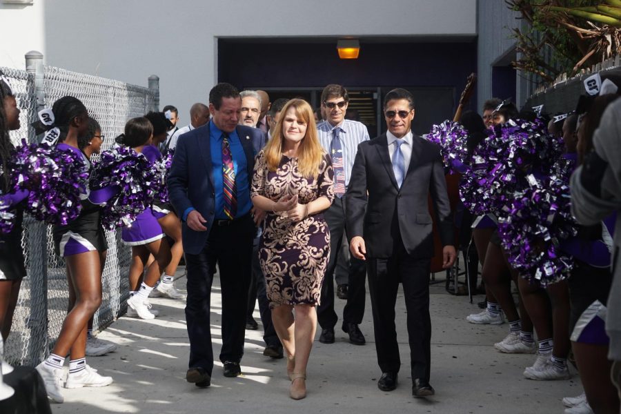 (From left to right) City of Aventura Commissioner Howard Weinberg, Chief Facilities Officer Jamie Torrens, Principal Allison Harley, School Board Representative Martin Karp and Superintendent Alberto Carvalho walk through rows of cheerleaders to break ground at the iPrep construction site on Nov. 6, 2017. Cheerleaders, NJROTC cadets and orchestra students greeted officials prior to the ceremony.