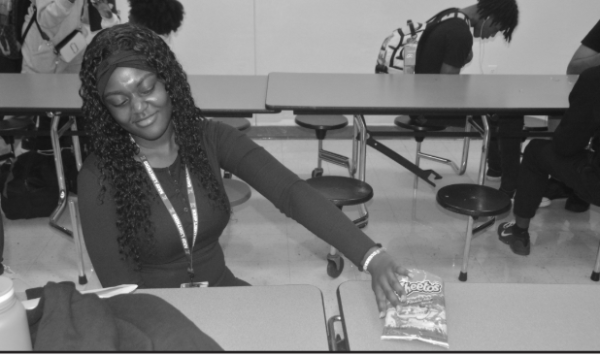 SAYING NO: junior Nicknise Denis turns down a bag of Hot Cheetos during lunch.