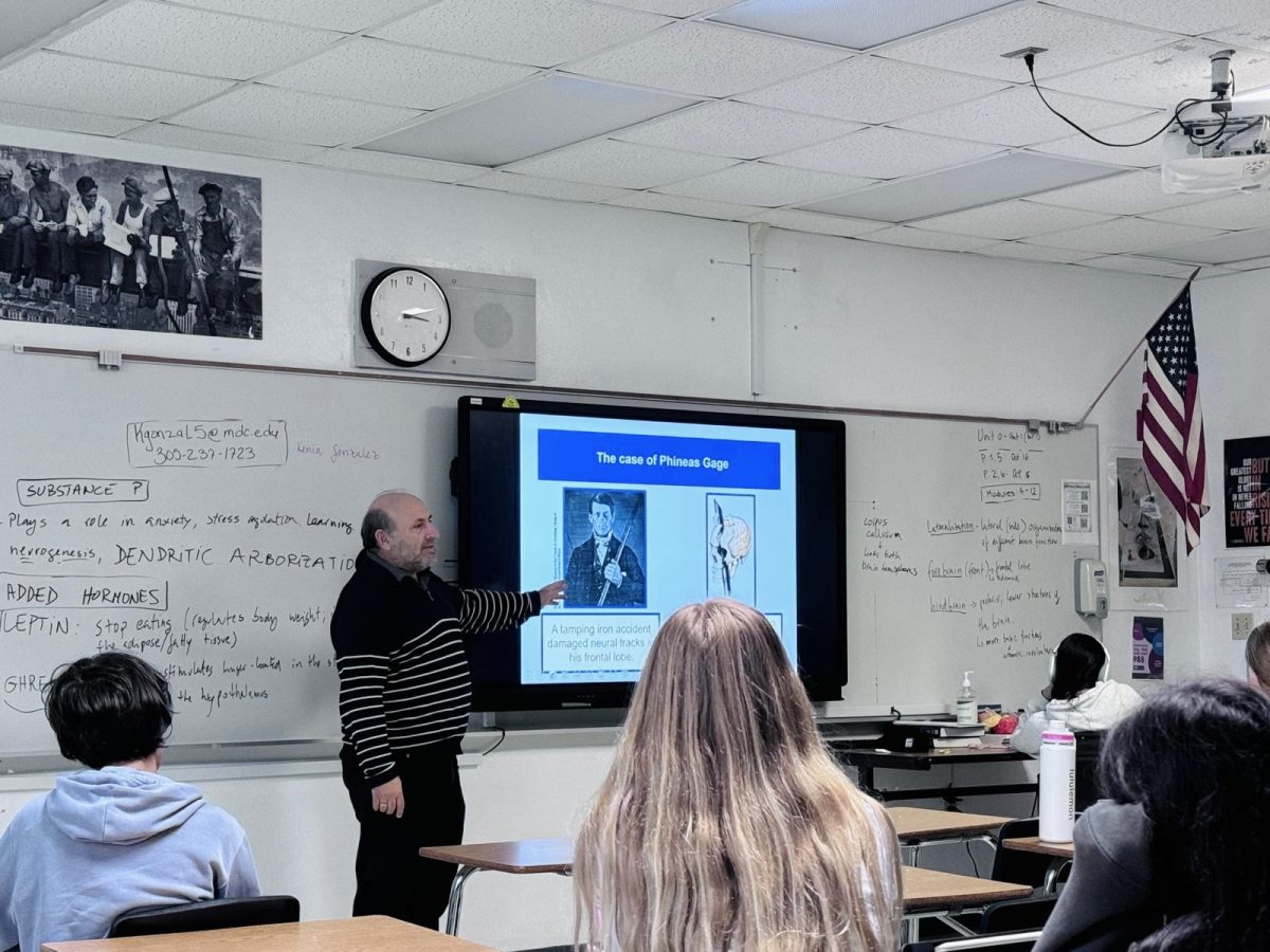 TEACHING: Psychology Teacher Arturo Tenacio teaches his AP Psychology class, which will involve a digital exam this year.