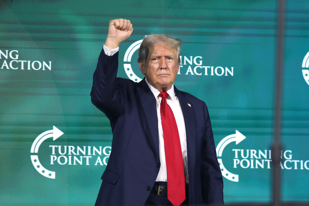 FIST UP: President Elect Donald J. Trump raises his fist while speaking at Turning Point Action, an organization that has dedicated itself to fighting supposed leftist overreach, including in schools. 